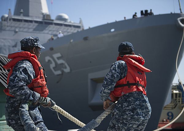Line handlers assigned to Naval Station San Diego release the mooring lines as the amphibious transport dock ship USS Somerset (LPD 25), departs for a scheduled deployment. Somerset is a part of the Makin Island Amphibious Ready Group, which will serve in the U.S. 3rd, 5th, and 7th Fleet area of operation, providing maritime security operations, crisis response capability, theater security cooperation and forward naval presence.  U.S. Navy Photo by Seaman Kelsey Hockenberger (Released)  161014-N-VR594-347