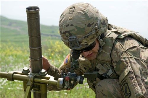 Spc. Ryan Krobath, a mortarman assigned to Troop C, 1st Squadron, 91st Cavalry Regiment, 173rd Abn. Bde., sets up a mortar system, making sight adjustments before the team began unpacking the mortar rounds May 20, 2015. The Soldiers trained at Vaziani Training Area, Georgia, during Exercise Noble Partner a field training and live-fire exercise between the U.S. Army and the Georgian military to support Georgia's participation in the NATO Response Force and build military ties between the two nations. (U.S. Army Photo by Sgt. Daniel Cole, Army Europe Public Affairs)