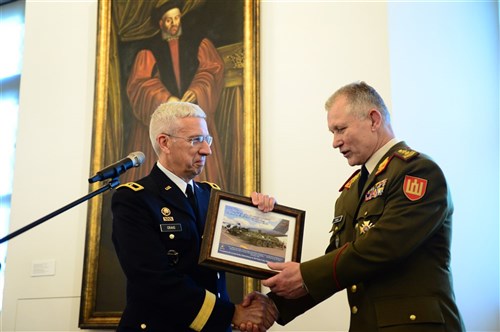 Pennsylvania Adjutant General Maj. Gen. Wesley Craig presents Lithuania's outgoing Chief of Defence, Lt. Gen. Arvydas Pocius, with a token of appreciation for his service and partnership. The photo depicts a Stryker vehicle from the Pennsylvania Army National Guard 56th Brigade, 28th Infantry Division, arriving via a West Virginia Air National Guard 167th Airlift Wing C-5 to participate in USAREUR exercise Saber Strike 2014. The Pennsylvania-Lithuania National Guard Partnership is one of 22 European partnerships that make up U.S. European Command's State Partnership Program and one of 65 worldwide partnerships that make up the National Guard State Partnership Program. 
