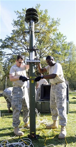 Airmen participating in the exercise Cadre Focus at the Grafenwoehr Training Area, Grafenwoehr, Germany set up a field radar system Sept. 22, 2010. Cadre Focus is a week-long training exercise for Air Force Battlefield Weather Technicians deploying in support of the Army. (U.S. Army photo by Pfc. Michael Iacona, 110th Public Affairs Detachment)