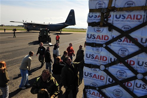 PISA, Italy (Mar. 4 2011)--U.S. Airmen from the 435th Air Mobility Squadron out of Ramstein Air Base load blankets, tarps and water containers onto C-130 aircraft in Pisa, Italy. These aircraft will then fly these supplies to Tunisia. The U.S. Government is working intensely with the International community to meet the humanitarian needs of the Libyan people and others in the country who fled across the borders. (U.S. Army Photo by Staff Sgt. Brendan Stephens/RELEASED)
