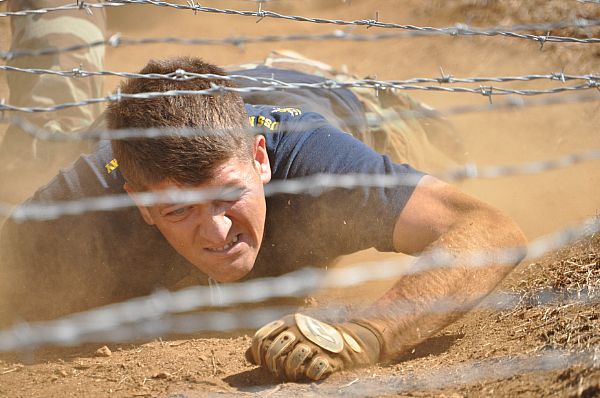 Chief Intelligence Specialist (Sel.) Gabriel Paine, assigned to Commander, Submarine Force U.S. Pacific Fleet, competes in the annual Chief Selectee FMF Challenge at the Marine Corps obstacle course at Kaneohe Marine Corps Base.  U.S. Navy photo by Chief Electronic Technician Richard Nickell (Released)  100902-N-7419N-001