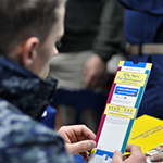 Service member viewing a brochure