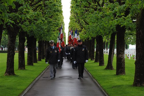 Volunteers march in to the Saint Mihiel American Cemetery during the Memorial Day ceremony there, May 26. 