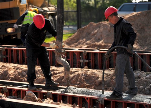 A construction crew from a local Latvian company, SIA "Ekers," lays the foundation for the new three-bay garage at the firehouse in Gulbene, Latvia May 14, 2012. The new garage is designed to accommodate larger, more modern fire trucks which have recently been added to the Gulbene fleet. The project will also include a series of renovations to the existing garage - new doors, improved ventilation, electrical system work and a roof replacement.