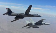 A B-1B Lancer and EA-18G Growler bank to the left during a training sortie near Ellsworth Air Force Base, S.D., July 15, 2016. The training focuses on further improving joint mission tactics between the Air Force and Navy. Courtesy photo