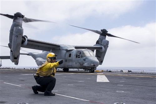 ATLANTIC OCEAN - Aviation Boatswain's Mate (Handling) 3rd Class Hilda Martinez signals an MV-22B Osprey for take off aboard the amphibious assault ship USS Wasp (LHD 1) July 9, 2016. Wasp is deployed with the Wasp Amphibious Ready Group to support maritime security operations and theater security cooperation efforts in the 6th Fleet area of operations. (U.S. Navy photo by Mass Communication Specialist 3rd Class Rawad Madanat)