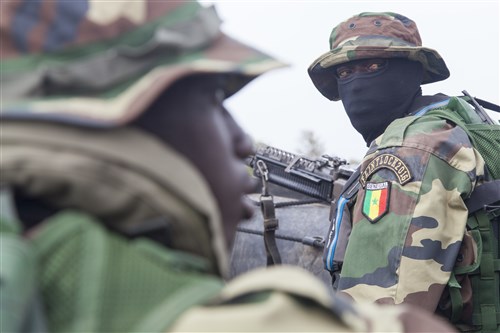 A Senegalese Special Operations Forces Soldier waits for hand signals while in a Zodiac boat in Saint Louis, Senegal, Feb. 12, 2016. The Senegalese hosted Flintlock for the third time this year. More than 1,700 Soldiers from over 30 nations participated in this year's exercise aimed at strengthening Special Operations Forces bonds between participating nations. (U.S. Army Photo by Spc. David M. Shefchuk/Released)