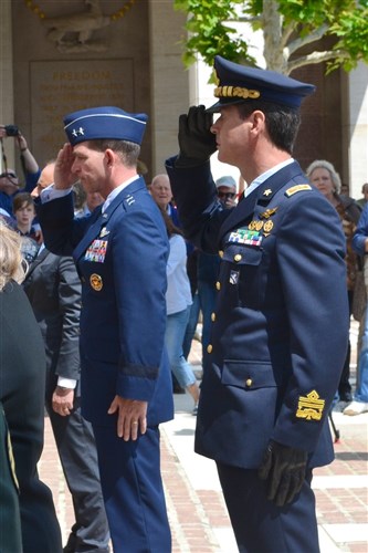 EUCOM Chief of Staff Maj Gen Mark Barrett and Italian Air Force Maj Gen Pietro Valente salute after the laying of the wreaths during the Memorial Day ceremony at the Florence American Cemetery May 28, 2012.