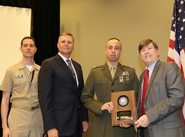 (April 20, 2016) Capt. Robert Rivera, center right, operations officer at Defensive Cyber Operations MCEN Operations Branch, receives the 