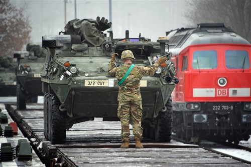 U.S. Soldiers, assigned to Lightning Troop, 3rd Squadron, 2nd Cavalry Regiment, load Stryker Fighting Vehicles on rail cars at Rose Barracks’ railhead station, Vilseck, Germany, Jan. 7, 2016. The squadron will deploy to Lithuania to take part in Atlantic Resolve North. The operation takes place in Estonia, Latvia and Lithuania. These training events improve interoperability, strengthen relationships and trust among allied armies, contribute to regional stability, and demonstrate U.S. commitment to NATO. (U.S. Army photo by Visual Information Specialist Gertrud Zach/Released)