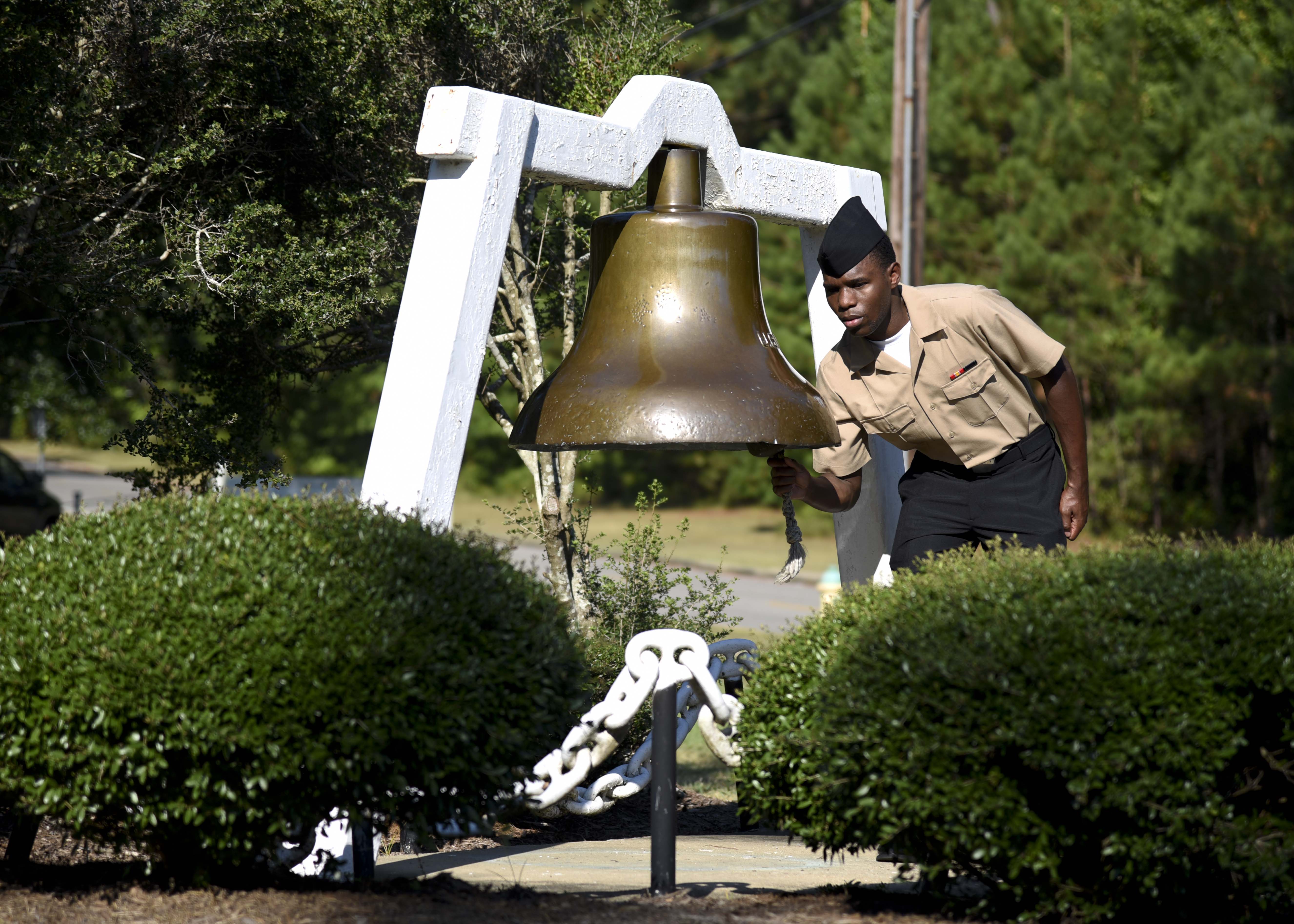 160922-N-CH038-050 -- Yeoman Seaman Recruit Kuron McDonald rings a bell at the Bells Across America memorial event on board Naval Air Station Meridian. The event recognized the sacrifices of fallen service members and their families. (U.S. Navy photo by MC2 Chris Liaghat/Released)