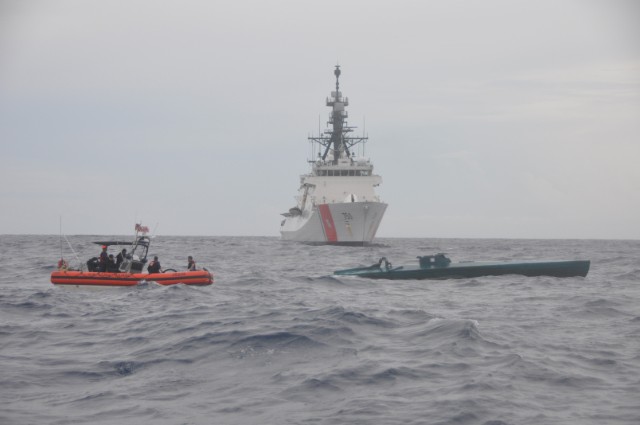 A Coast Guard Cutter Bertholf boarding team conducts an interdiction of a self-propelled semi-submersible vessel suspected of smuggling 7.5 tons of cocaine in the Eastern Pacific Ocean, Aug. 31, 2015. 