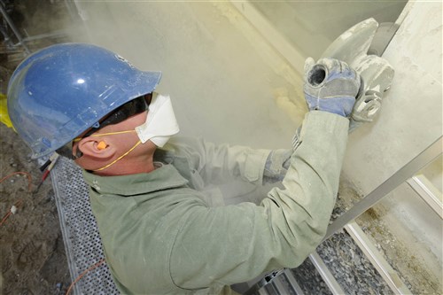 Tech. Sgt. Derek Leppek, 127th Civil Engineering Squadron structures supervisor, cuts into the concrete around a window of a kindergarten school in Silmala, Latvia on June 19, 2016. The school is undergoing construction as part of the U.S. European Command’s Humanitarian Civic-Assistance project. United States and Latvian military engineers are working together to complete the project. (U.S. Air National Guard photo by Senior Airman Ryan Zeski)