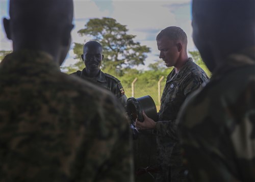U.S. Marine Staff Sgt. Malachi McPherson, an explosive ordnance disposal technician with Special-Purpose Marine Air-Ground Task Force Crisis Response-Africa, shows some of the different types of improvised explosive devices to members of the Uganda People’s Defense Force during an IED awareness class at Camp Singo, Uganda, Nov. 2, 2015. Marines and sailors with SPMAGTF-CR-AF are training with the UPDF to increase engineering and logistical capabilities while strengthening the bonds between the partner counties. (U.S. Marine Corps photo by Cpl. Olivia McDonald/Released)