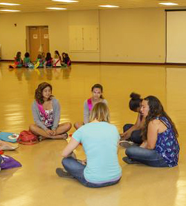 Girls sitting in a circle, talking during a retreat