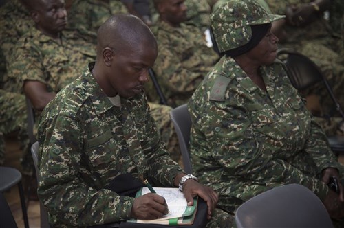 A member of the Uganda People’s Defense Force takes notes during a mental health sharing of best practices Oct 10, 2016.  The class was held by a member from Combined Joint Task Force-Horn of Africa to discuss ways to identify, prevent and treat combat stress on the battlefield. (U.S. Air Force photo by Staff Sgt. Eric Summers Jr.)