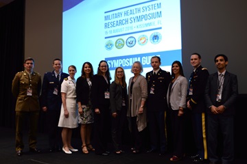 Dr. Karen Guice, acting assistant secretary of Defense for Health Affairs, fifth from right, congratulated the finalists in the Military Health System Research Symposium 2016 Young Investigators competition. 