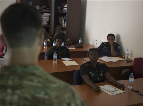 U.S. Army Sgt. Nathaniel Mitcavish, Combined Joint Task Force-Horn of Africa Civil Affairs specialist, discusses essential tasks for Civil-Military Cooperation (CIMIC) officers Feb. 3, 2016, at Rwanda Defense Force headquarters, Kigali, Rwanda.  During the engagement, U.S. Army civil affairs and Rwanda Defense Force CIMIC personnel discussed similarities and differences between the organizations. The RDF plans to use the knowledge gained during the event to address training and organizational needs for their forces. (U.S. Air Force photo by Senior Airman Peter Thompson)