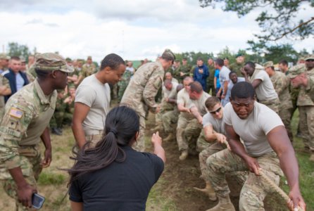 U.S. Army Soldiers assigned to 1st Battalion, 41st Field Artillery Regiment, 1st Armor Brigade Combat Team, 3rd Infantry Division, cheering on their teammates, in a tug of war competition with multi-national allies, during Exercise Flaming Thunder at Pabrade, Lithuania, Aug. 7, 2016. Flaming Thunder is a two-week long multinational fire coordination exercise and combined arms live fire to enhance interoperability among NATO fire support units, and to train and conduct joint fire support with the integration of maneuver elements, close air support and close combat attack.