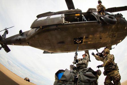 Soldiers with the 407th Brigade Support Battalion, 2nd Brigade Combat Team, attach a sling-load to the belly of a UH-60 Black Hawk assigned to the 82nd Combat Aviation Brigade, during a sling load training event at Holland Drop Zone on Fort Bragg, N.C., Aug. 24, 2016.