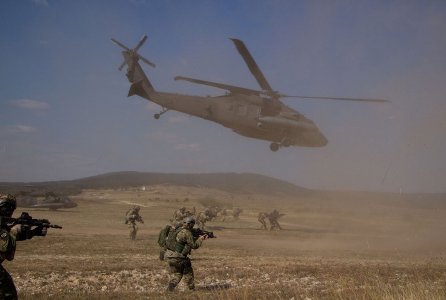 Army Special Forces and their NATO allied counterparts conduct an air assault on a small compound, Sept. 27, 2016, during Brave Warrior 2016/Black Swan at Bakony Combat Training Center, Hungary. The 3rd Battalion, 501st Aviation Regiment, 1st Armored Division, Combat Aviation Brigade, provided UH-60 Black Hawk support for the training mission. The exercise brings nations together to enhance interoperability and strengthen allied relationships.