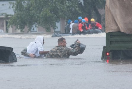North Carolina Army National Guardsmen and local emergency services assist with evacuation efforts in Fayetteville, N.C., Oct. 08, 2016. Heavy rains caused by Hurricane Matthew have led to flooding as high as five feet in some areas.