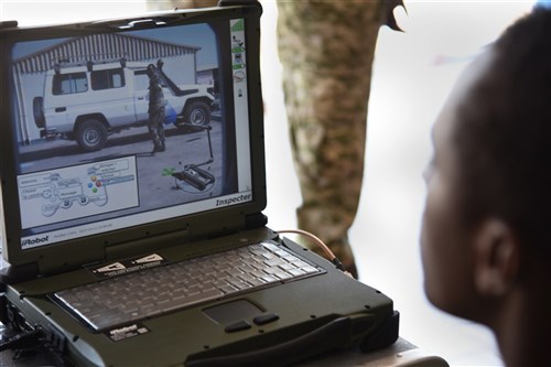 Members of the Djibouti Armed Forces (FAD) monitor a computer transmitting video from the iRobot 510 Packbot Oct. 12, 2015, in Djibouti. The robot can perform bomb disposal, surveillance and reconnaissance operations. 