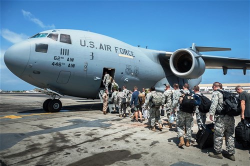 141019-Z-VT419-207: A group of 30 U.S. military personnel, including Marines, Airmen, and Soldiers from the 101st Airborne Division, board a U.S. Air Force C-17 Globemaster III at Léopold Sédar Senghor International Airport in Dakar, Senegal, Oct. 19, 2014. The service members are bound for Monrovia, Liberia, where troops will construct medical treatment units and train health care workers as part of the Operation United Assistance, DoD’s support the USAID-led, whole-of-government effort to respond to the Ebola outbreak in West Africa. (U.S. Air National Guard photo by Maj. Dale Greer/Released)