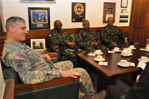 Gen. David Rodriguez, commander, U.S. Africa Command (left) meets with Gen. Abayomi Olonisakin Nigeria chief of defence staff (second from left) and several of his senior military leaders during an office call.  AFRICOM hosted a two-day meeting that brought together the component commanders and several senior members of the Nigerian military.  The purpose of the visit was to reinforce the importance of a strong US-Nigeria security cooperation relationship, with topics focused on ways to counter terrorism, joint operations, logistics and maritime security in the Gulf of Guinea, Feb. 10, 2016, U.S. Army Garrison Stuttgart, Germany. (Photo by Brenda Law, U.S. Africa Command Public Affairs/RELEASED)