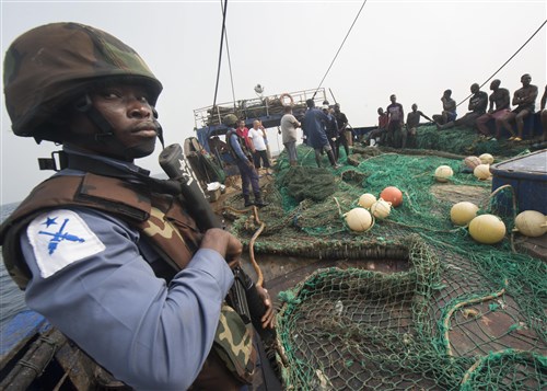 (Feb. 6, 2016) - A member of the Ghanaian Navy stands aboard a fishing vessel during a combined joint boarding operation Feb. 6, 2016. The Military Sealift Command expeditionary fast transport vessel USNS Spearhead (T-EPF 1) is on a scheduled deployment to the U.S. 6th Fleet area of operations to support the international collaborative capacity-building program Africa Partnership Station. 