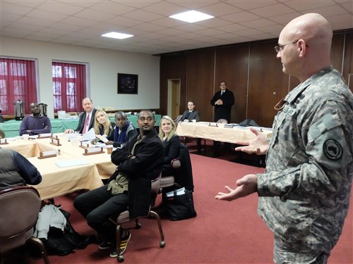 COL Mark Cheadle, AFRICOM’s Chief of Public Affairs and Communication Synchronization, engages African journalists during a media delegation visit, Feb. 9, 2015, at Kelley Barracks, U.S. Army Garrison, Stuttgart, Germany.  Eight journalists, who are accredited with the African Union, are here as participants of a U.S. AFRICOM-sponsored media delegation visit to learn about the command's mission and programs. (Photo by Brenda Law/U.S. Africa Command Public Affairs/Released)