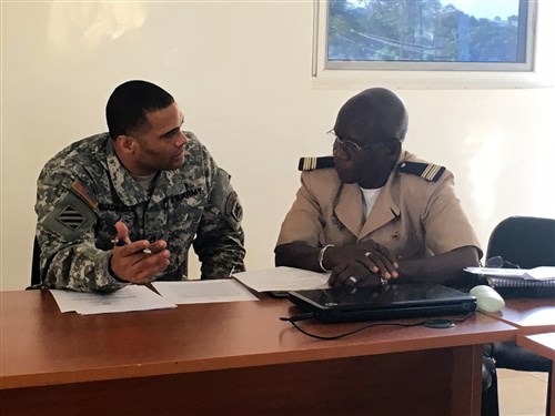 Sgt. First Class Jason Giacomucci, logistics planner for U.S. Army Africa, and Lt. Col. Mamadou Laminet Kouate, logistics officer for the Senegalese Army, discuss plans to support the African Readiness Training 2016 exercise during the initial planning event in Dakar, Senegal, Jan. 12-14. (U.S. Army Africa photo by Capt. Anielka DiFelice)
