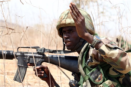 A Senegalese soldier with 1st Paratrooper Battalion gives movement orders to his team during a squad-level exercise July 14, 2016 in Thies, Senegal as part of Africa Readiness Training 16. ART16 is a U.S. Army Africa exercise designed to increase U.S. and Senegalese readiness and partnership through combined infantry training and live-fire events. (U.S. Army photo by Staff Sgt. Candace Mundt/Released)