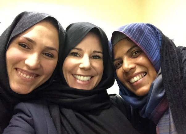 Marci Strathearn, middle, poses for a photograph with her Afghan colleagues. Strathearn, a former Army captain, has been in Afghanistan for the past 18 months trying to improve women's rights in the male-dominated country as an advisor for the U.S. Defense Department's Ministry of Defense Advisors program. She recently won a national award for her ongoing commitment to gender equality.