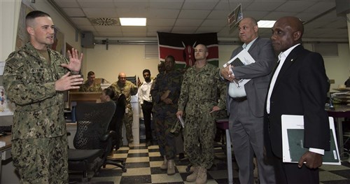 Ambassador Issimail Chanfi, director of the Eastern Africa Standby Force, right, receives an introduction to the Fusion Action Cell at Camp Lemonnier, Djibouti, Oct. 27, 2015. The FAC is comprised of service members from the U.S., Europe and East Africa working together to setup military-to-military projects and civilian support initiatives in partner countries throughout the Horn of Africa. (Combined Joint Task Force-Horn of Africa photo/Released)