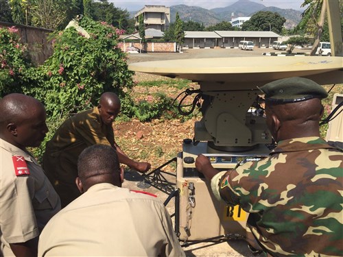 Burundian National Defense Force Soldiers work together to install their African Data Sharing Network terminal June 8-17, 2016, at Bujumbura, Burundi. Combined Joint Task Force–Horn of Africa communication Soldiers led a sharing of best practices for installing, operating, and maintaining their ADSN satellite terminal. The ADSN communication package provides a dynamic intelligence sharing platform for the African Union Mission in Somalia’s troop contributing countries. (U.S. Army photo by 1st Lt. Justin R. Klatt/Released)