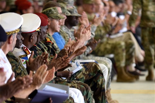 Service members, diplomats and multi-national guests applaud during a change of command ceremony April 13, 2016, at Camp Lemonnier, Djibouti. Sonntag is now in command of CJTF-HOA and responsible for its impact on the East African region. (U.S. Air Force photo by Staff Sgt. Kate Thornton/Released)