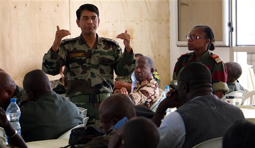 Indian Army Lt. Col. Ajay Dogra, military training officer with the United Nations Department of Peacekeeping Operations, teaches Central Accord 2016 participants about U.N. functions and procedures June 14, at the Cooperative Security Location in Libreville, Gabon. U.S. Army Africa's exercise Central Accord 2016 is an annual, combined, joint military exercise that brings together partner nations to practice and demonstrate proficiency in conducting peacekeeping operations. (U.S. Army Africa photo by Staff Sgt. Candace Mundt/Released)