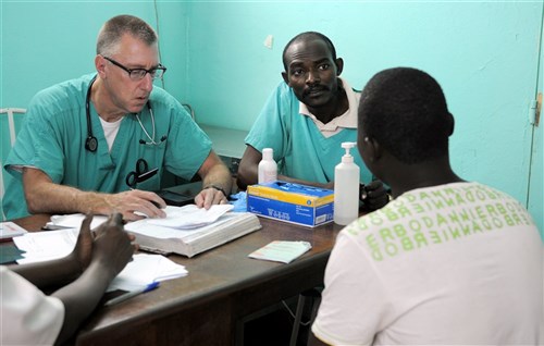 U.S. Army Reserve Maj. Joe Hollingsworth, an emergency physician with the 4005th U.S. Army Hospital, Army Reserve Medical Command, conducts a surgical consultation with a patient April 22, at the Hospital Militaire D’Instruction (Military Teaching Hospital) in N’Djamena, Chad. U.S. Army Africa announced another iteration of the recurring exercise will take place in Uganda in August 2015. (U.S. Army Africa photo by Staff Sgt. Andrea Merritt)