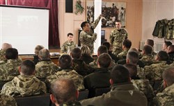 Col. John Maza, U.S. Special Operations Command Europe Surgeon, briefs Ukrainian Soldiers on Tactical Combat Casualty Care, Tuesday, November 18, 2014 in Khmelnytskyi, Ukraine. Maza led a medical team from SOCEUR to western Ukraine to coach and mentor Ukrainian Ministry of Defense personnel on basic battlefield medical procedures to enhance point of injury care.
