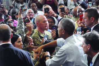 Obama thanks troops, pledges country will honor debt to those who serve