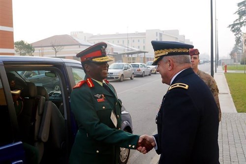 U.S. Army Africa Deputy Commanding General, Brig. Gen. Kenneth H. Moore, Jr. greets Botswana Commander, Maj. Gen. Molefi Seikano, during a command sponsored visit to Vicenza, Italy, Nov.30 to Dec. 3, 2015. The visit offer Seikano an opportunity to observe USARAF facilities and capabilities, as well as explore opportunities for future training and partnership. (U.S. Army Africa photo by Spc. Craig Philbrick)