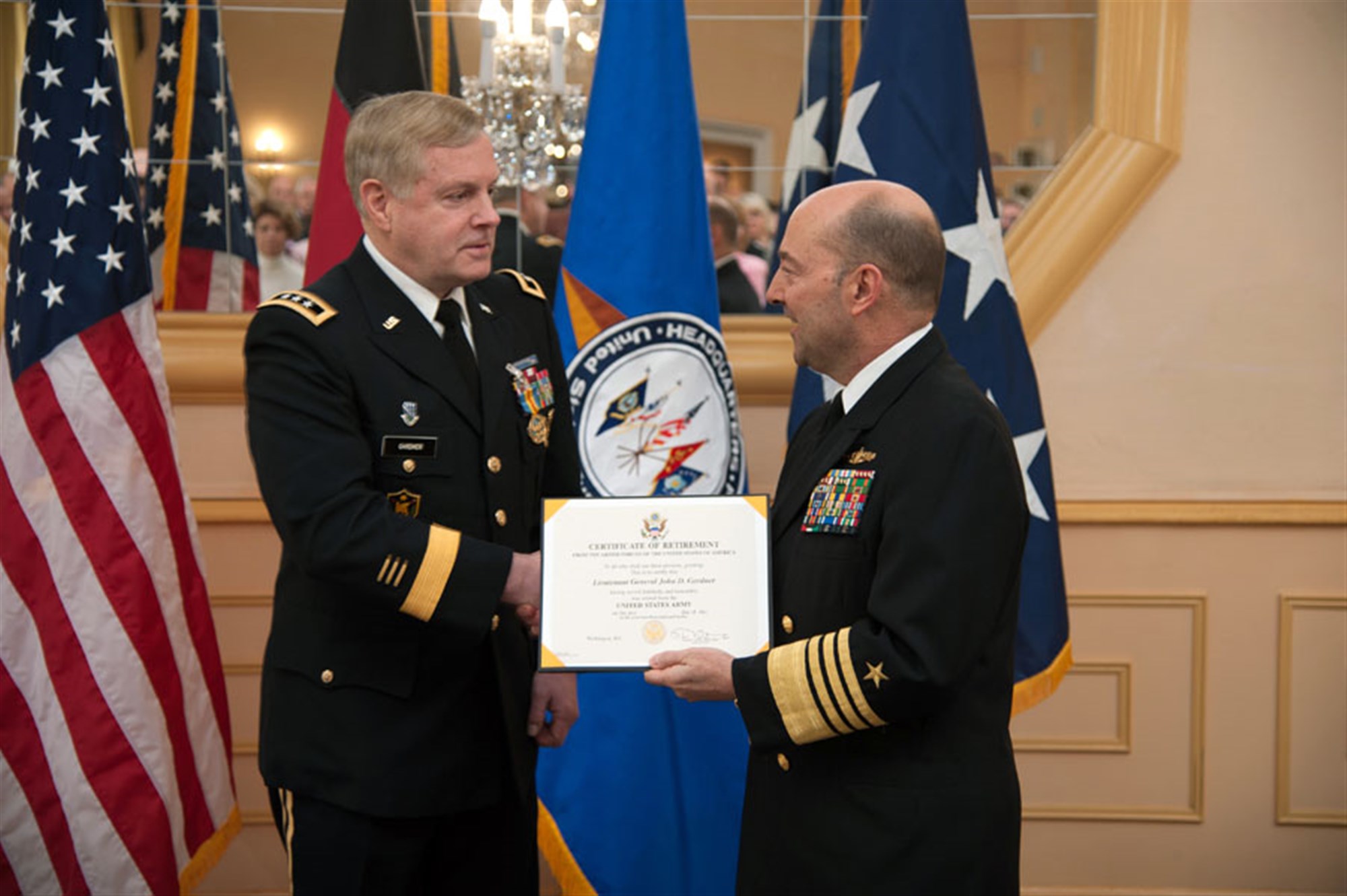 Admiral James G. Stavridis, the Commander, U.S. European Command and NATO Supreme Allied Commander Europe, presents Lieutenant General John D. Gardner, the former deputy commander of US EUCOM, his Certificate of Retirement during LTG Gardner's retirement ceremony, at the Schwabian Special Events Center on Patch Kaserne in Stuttgart-Vaihingen, Germany.