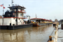 Ensley Engineer Yard and Marine Maintenance Center&#39;s Plant Section in operation. Motor Vessel Lusk and Motor Vessel Strong face up on both ends of the Revetment Mooring Barge 7401 removing it from dry dock 5801. (USACE Photo/Brenda Beasley)

