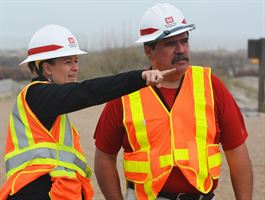 Civil engineers Laura Hemming and Rolando Serrano check on the progress of the Maintenance Dredging Morehead City Harbor Range A Project near Morehead City, North Carolina.  (USACE photo by Hank Heusinkveld)  