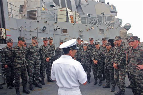 KOPER, Slovenia – Chief Personnel Specialist Carlos Peñarojas guides members of a Slovenian non-commissioned officer course on a tour of the guided-missile destroyer USS McFaul (DDG 74) during a recent port visit to Koper, Slovenia. McFaul is on a scheduled deployment in support of maritime security operations and theater security cooperation efforts in the U.S. 6th Fleet area of responsibility.