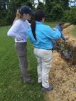 Carly Golden (left), a pathways intern from Brandeis University, an Brittany Dunn, a pathways intern from Christopher Newport University, discuss their observations during a field visit for a jurisdictional determination in Northampton County, Va.  The Pathways program offers three types of internship opportunities to individuals who are just starting out in their potential federal careers: the Internship Program, Recent Graduates Program and Presidential Management Fellows Program