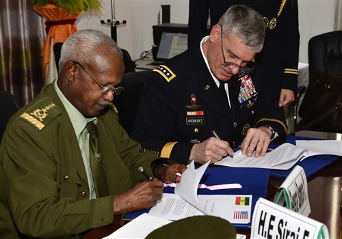 Gen. David Rodriguez, Commander U.S. Africa Command and en. Samora Yunis, Chief of Staff Ethiopian National Defense Force sign the summary of conclusions after a Bilateral Defense Committee (BDC) meeting in Addis Ababa, Ethiopia, 31 March, 2016. The new agreement out lines the cross-exchange of logistics, services, supplies and support, as well as a way forward for the Africa Data-Sharing Network and combat engineering. (U.S. Air Force photo by Tech. Sgt. Dan DeCook)  