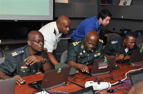 Cyber familiarization event attendees participate in a hands-on activity during a visit to the National Defense University in Washington, July 20, 2015. Officers from nine African nations attended the AFRICOM-sponsored event.